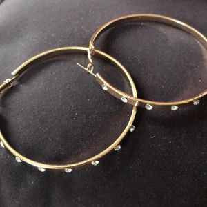 Gold hoops with jewels in front